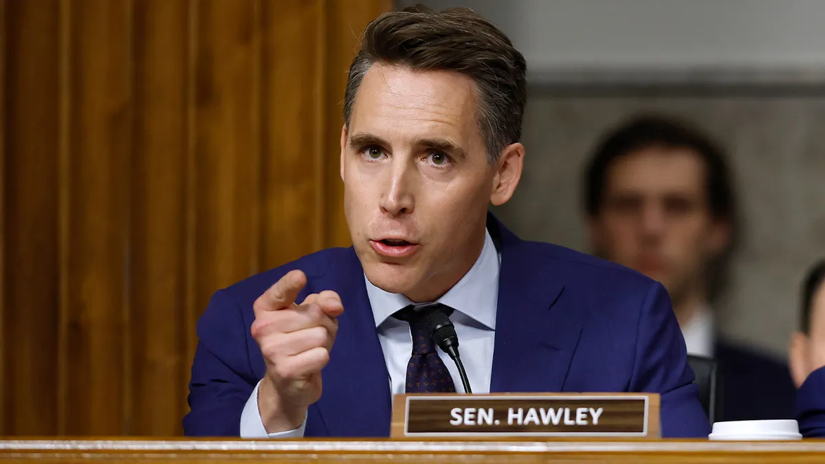 Sen. Josh Hawley questioning officials during Senate hearing in Capitol Hill office building