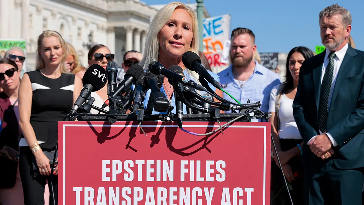 Rep. Marjorie Taylor Greene speaking at a news conference outside the U.S. Capitol with alleged victims of Jeffrey Epstein