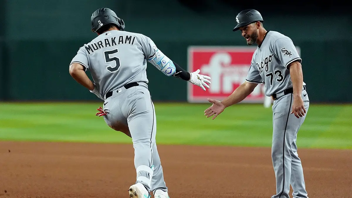 Munetaka Murakami celebrating home run with Jose Leger during baseball game in Phoenix