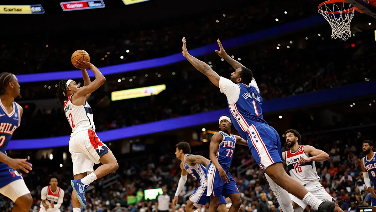 Washington Wizards guard Tre Johnson shooting over Philadelphia 76ers center Andre Drummond at Capital One Arena