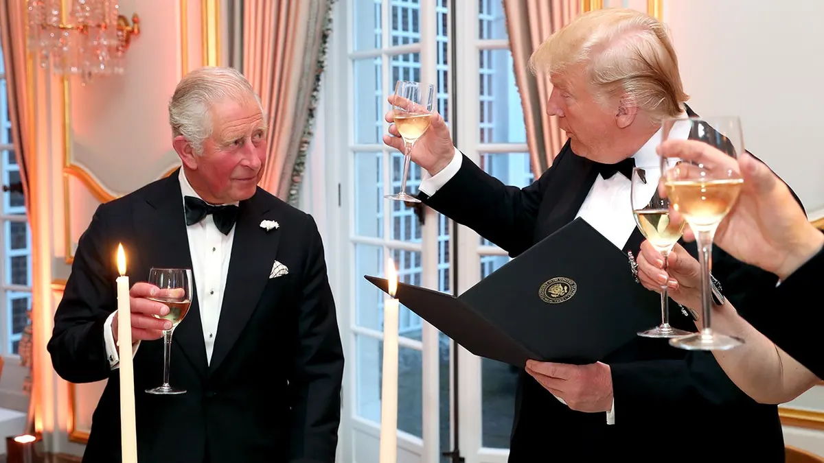 President Donald Trump and Prince Charles standing and toasting at a dinner event in London