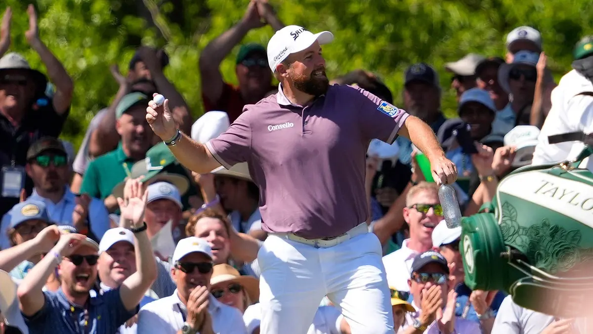 Shane Lowry celebrating after hitting a hole-in-one on the sixth hole at Augusta National Golf Club