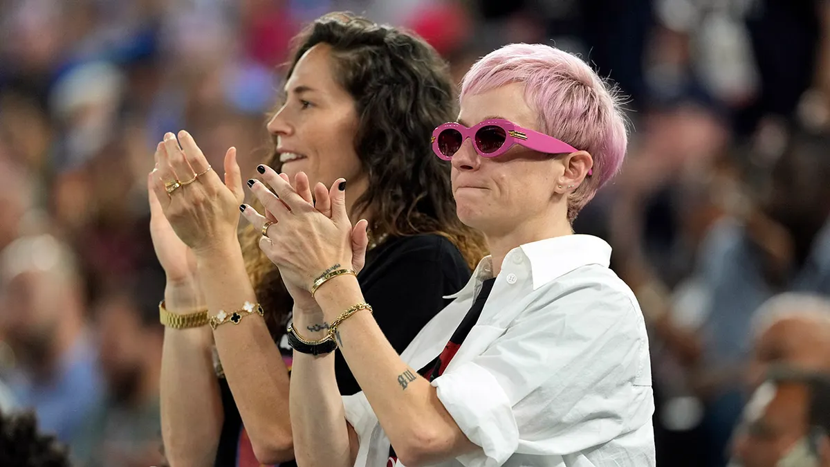 Sue Bird and Megan Rapinoe watching men's basketball gold medal game at Accor Arena