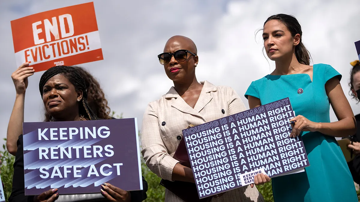 Rep. Cori Bush, Rep. Ayanna Pressley, and Rep. Alexandria Ocasio-Cortez speaking at a news conference on Capitol Hill