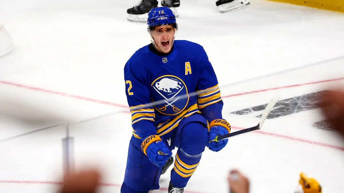Buffalo Sabres center Tage Thompson celebrating a goal on ice rink.