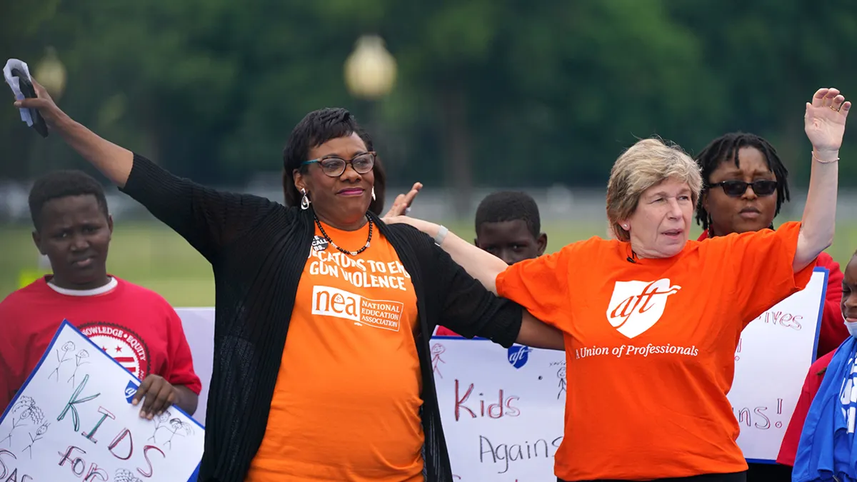 Becky Pringle and Randi Weingarten seated side by side