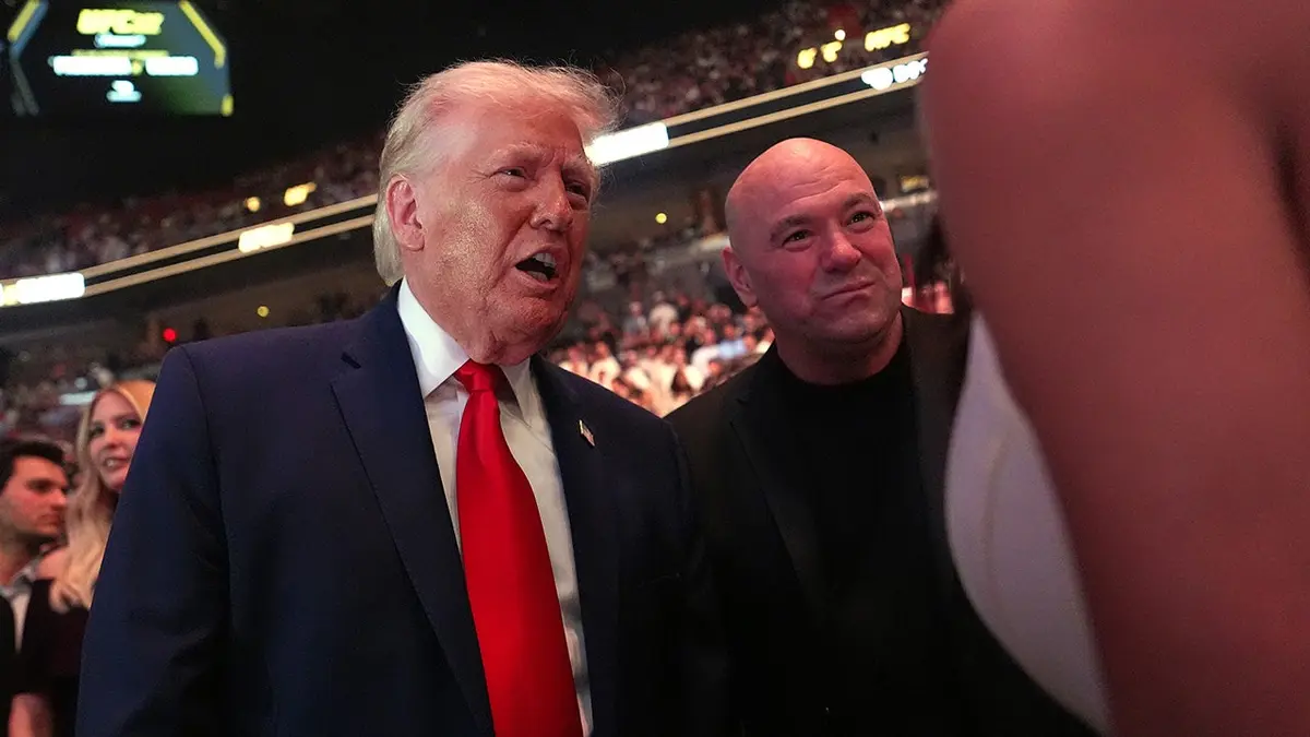U.S. President Donald Trump and UFC CEO Dana White speaking with guests at Kaseya Center in Miami