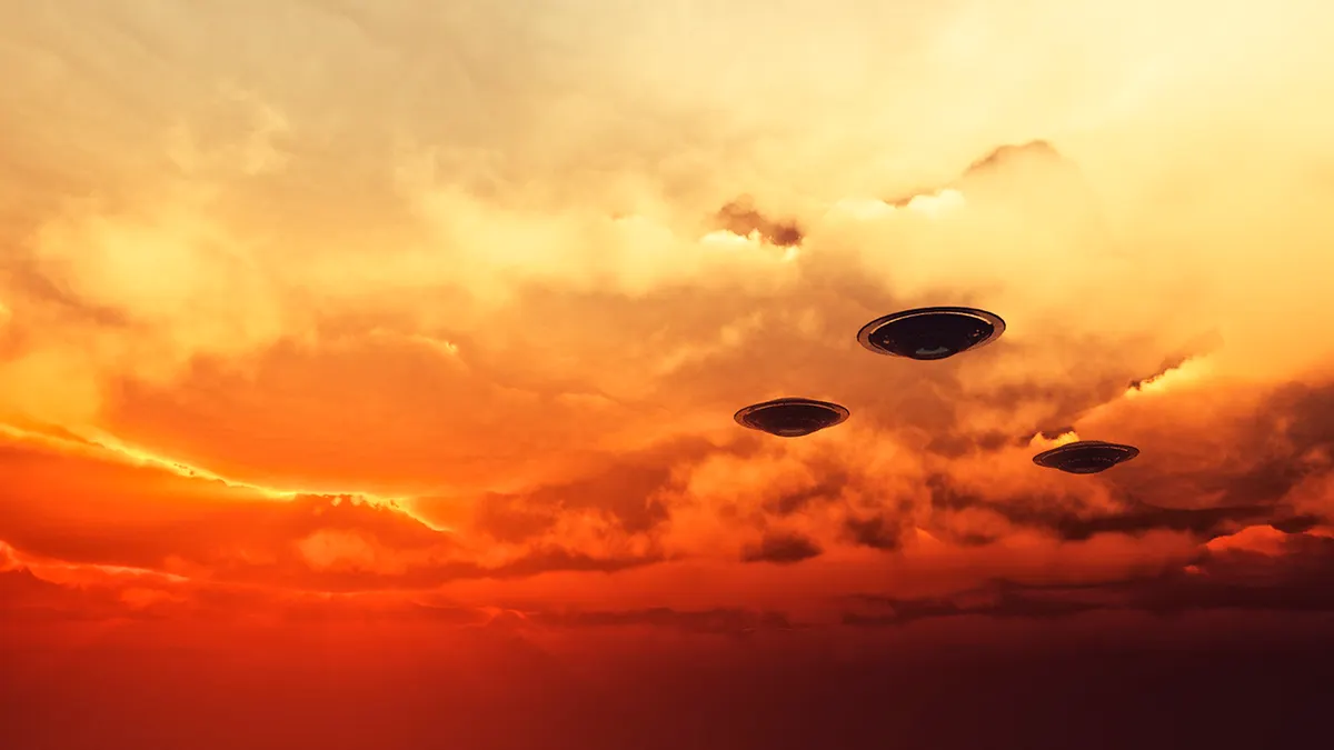 Multiple unidentified flying objects in a night sky.