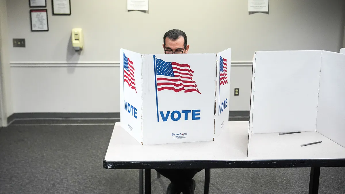 A person voting at Fairfax Government Center in Virginia.