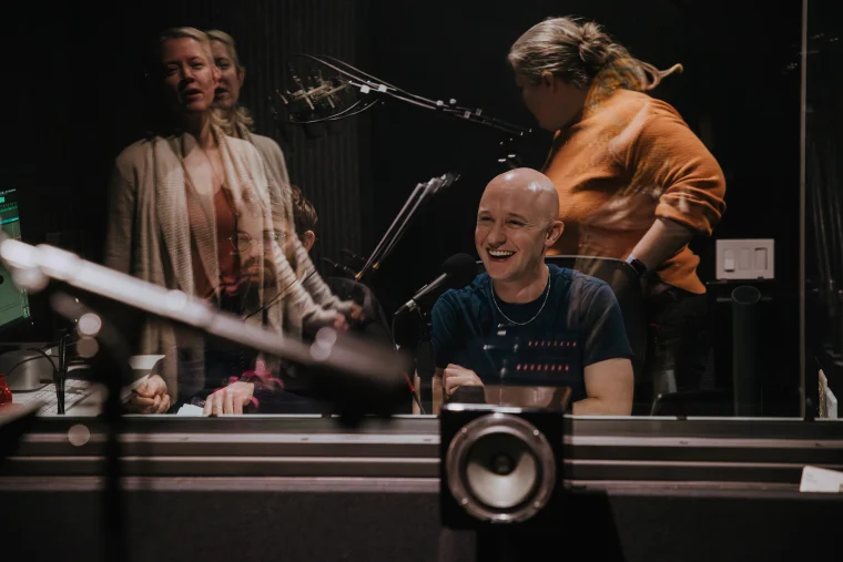 Mark Sanderlin in the recording studio with Patti Murin singing.