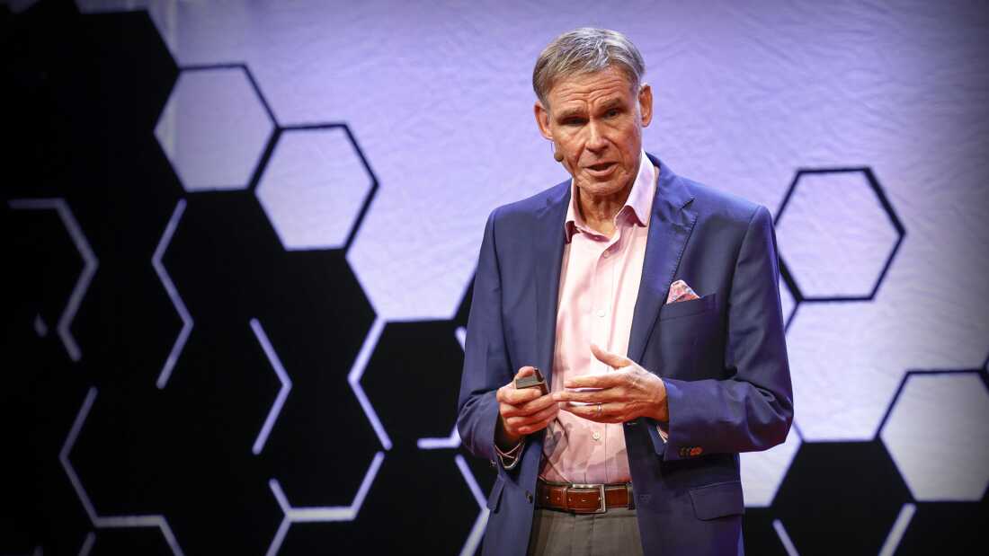 In this photo, Eric Topol stands onstage for his TED Talk "Can AI Catch What Doctors Miss?"