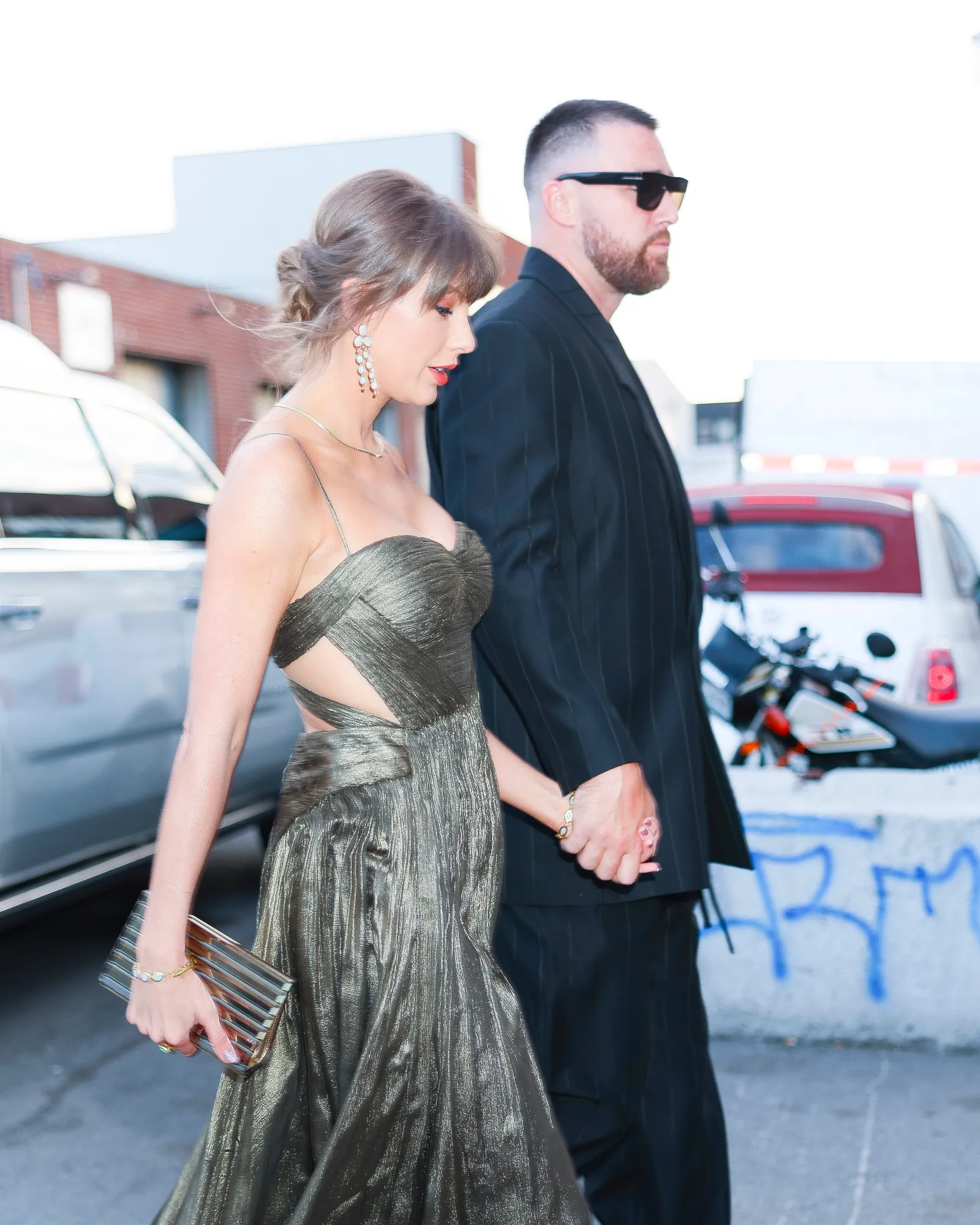 Image may contain Taylor Swift Travis Kelce Clothing Dress Formal Wear Fashion Evening Dress Adult and Person