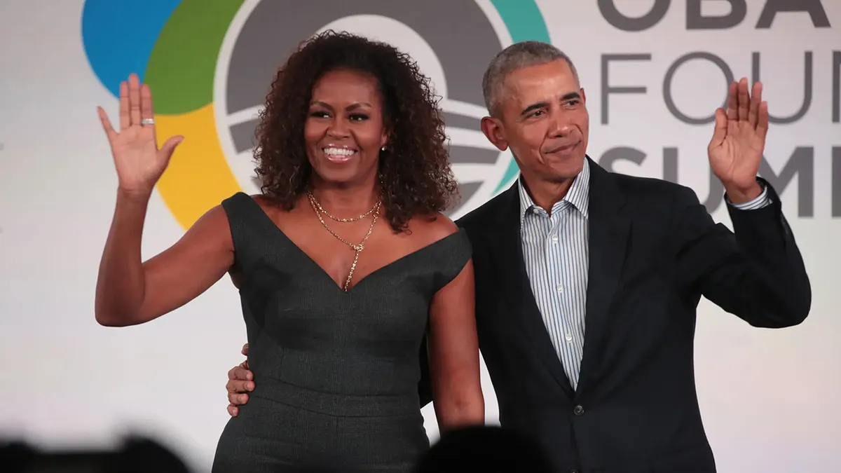 Michelle Obama and Barack Obama standing together at an event.