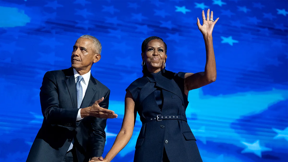Former President Barack Obama and former first lady Michelle Obama standing on stage at the Democratic National Convention in Chicago