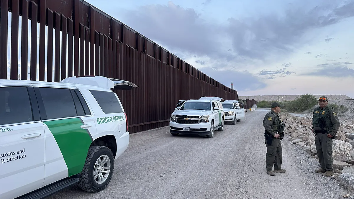 US Border Patrol agents securing the border fence in El Paso, Texas