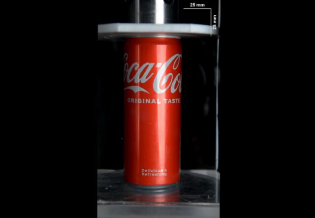 Soda can in a hydraulic press