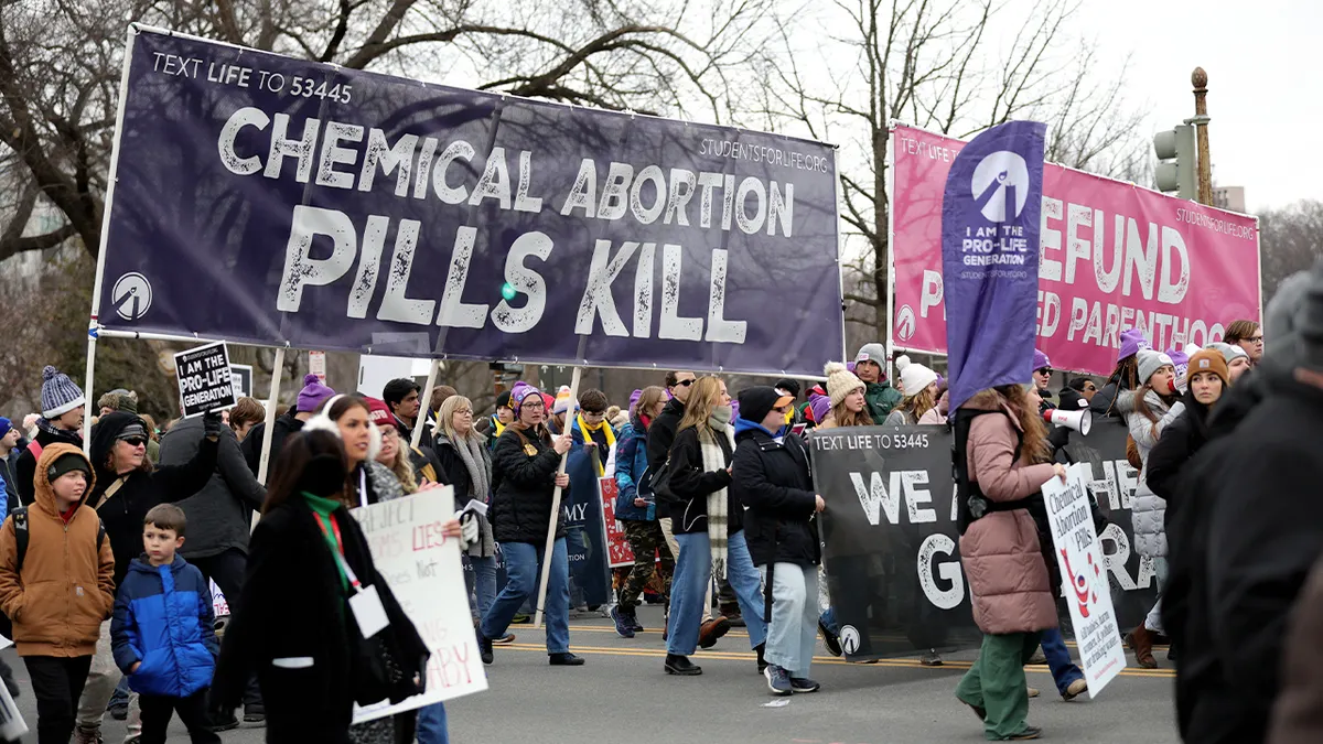 Anti-abortion rights demonstrators marching near the Supreme Court in Washington, D.C.